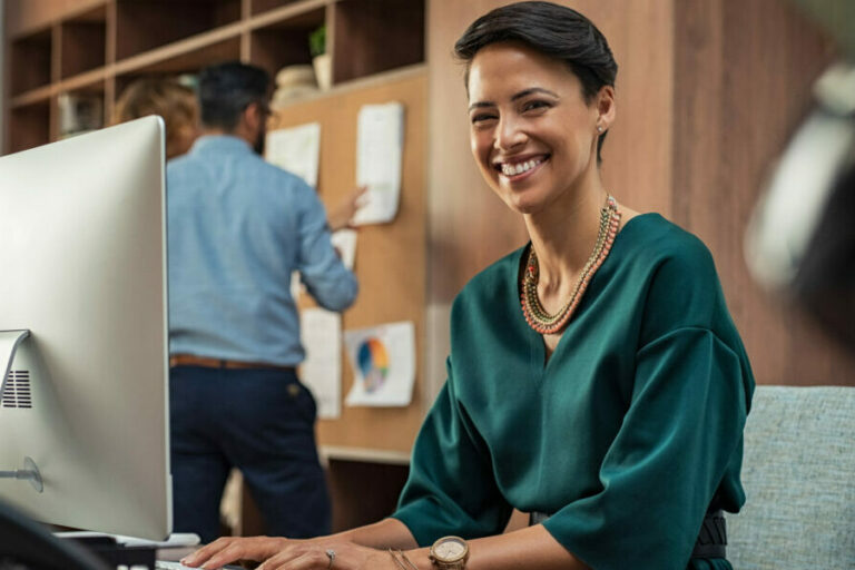 Young businesswoman smiling at office