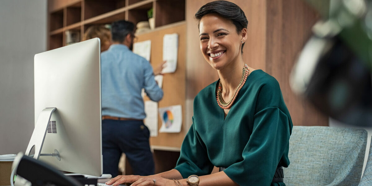 Young businesswoman smiling at office